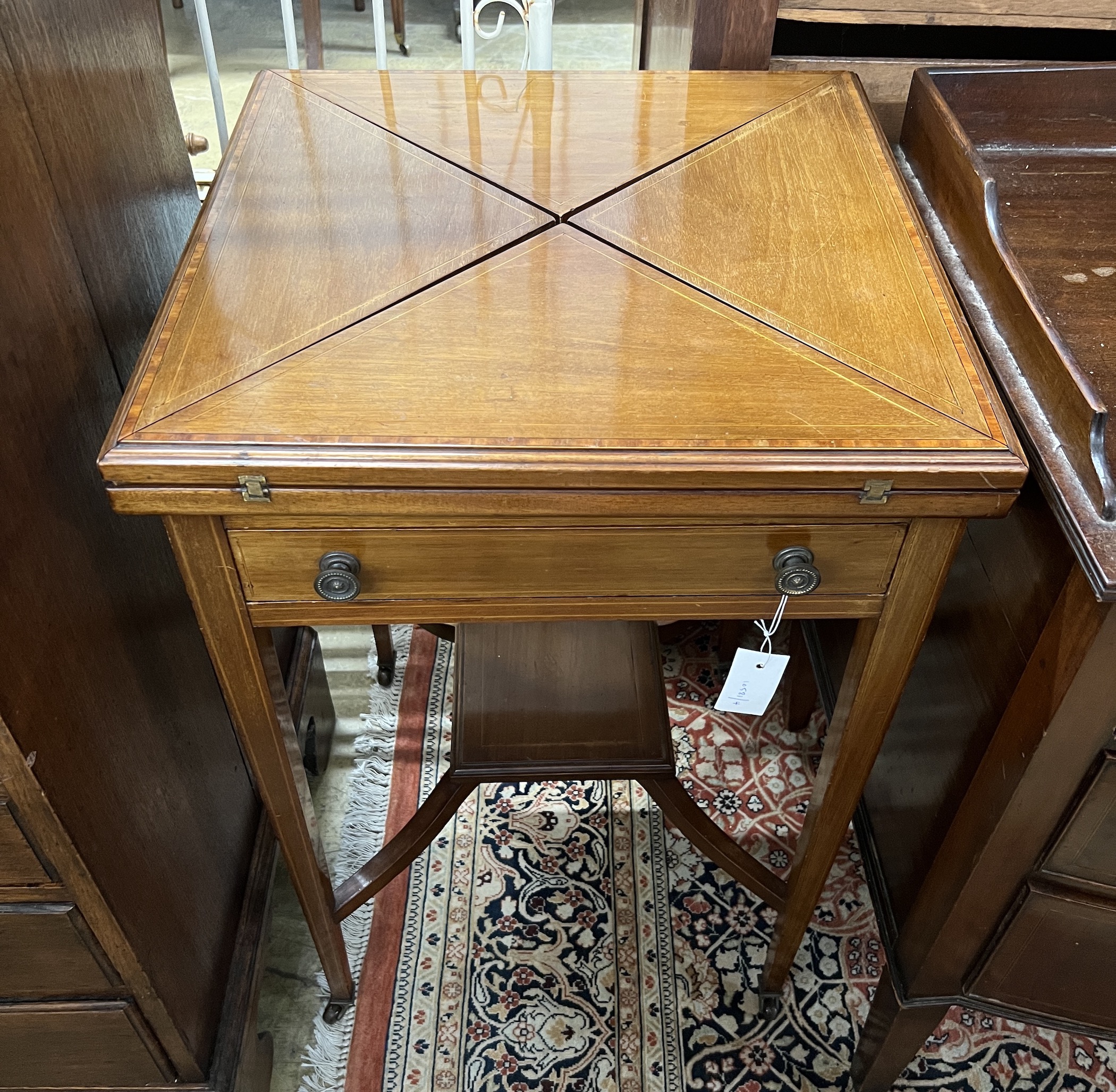 An Edwardian satinwood banded mahogany envelope card table, width 50cm, depth 50cm, height 77cm